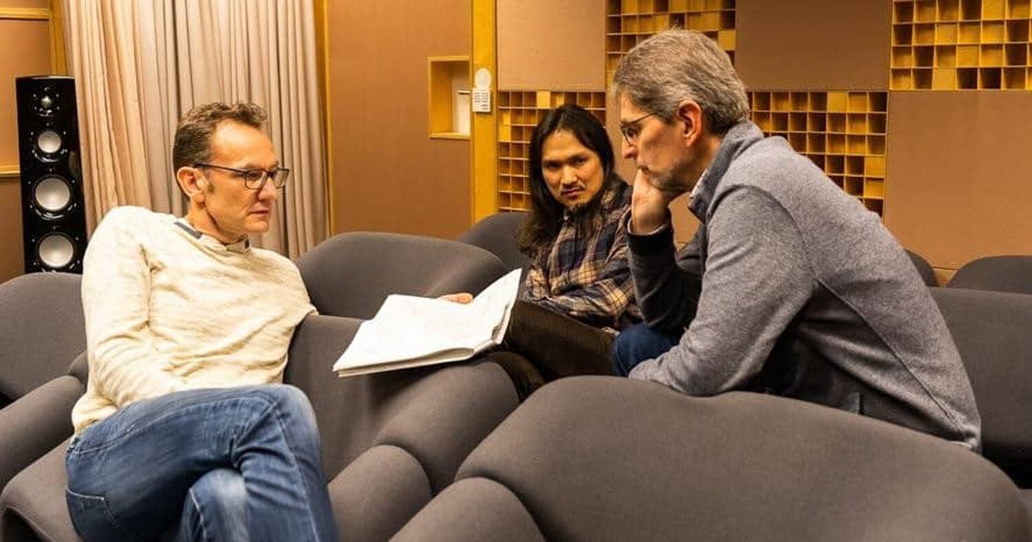 People reviewing a paper on a couch