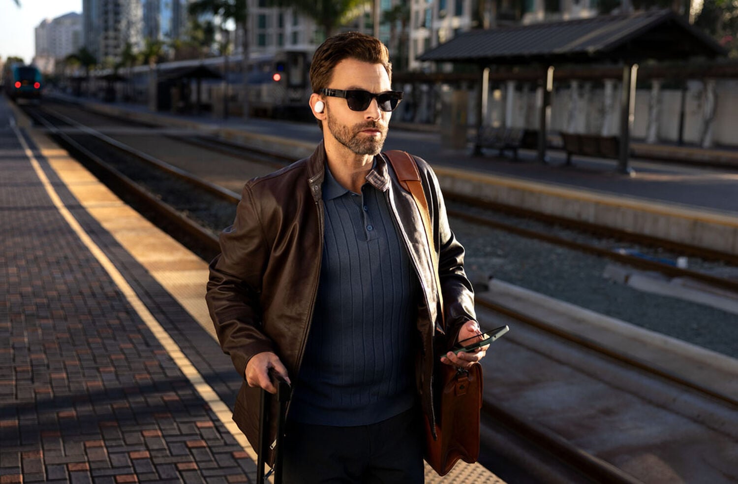 A man walking with headphones in