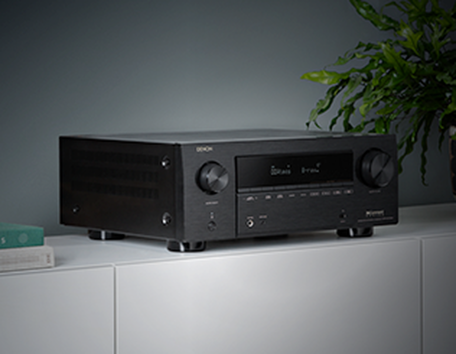 An AVR sitting subtly on a tv stand