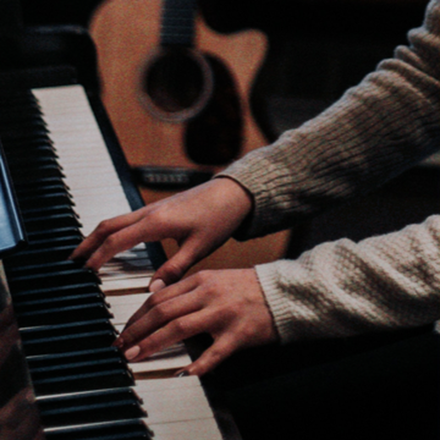Man's Hands on Piano