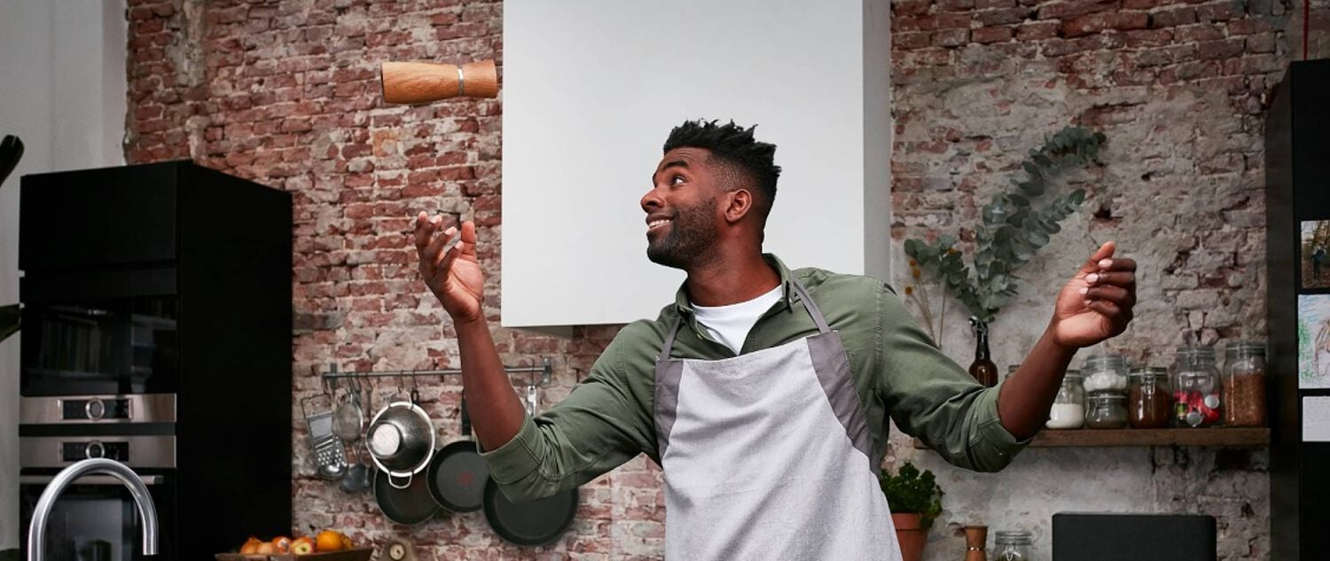 A man juggling a salt shaker 