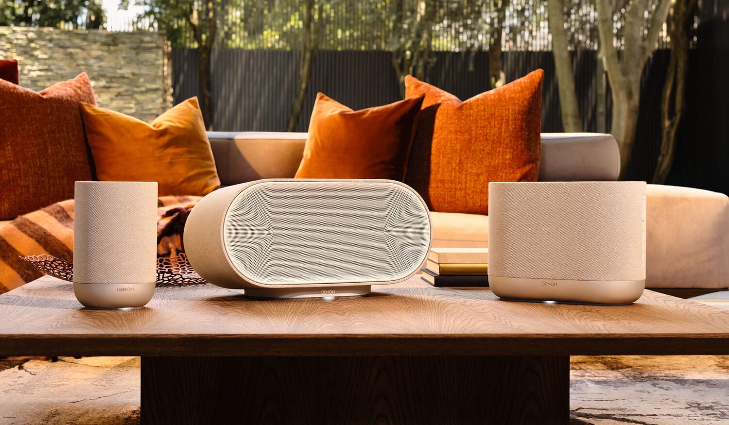 Denon Home 200 400 and 600 sitting on a table in a living area