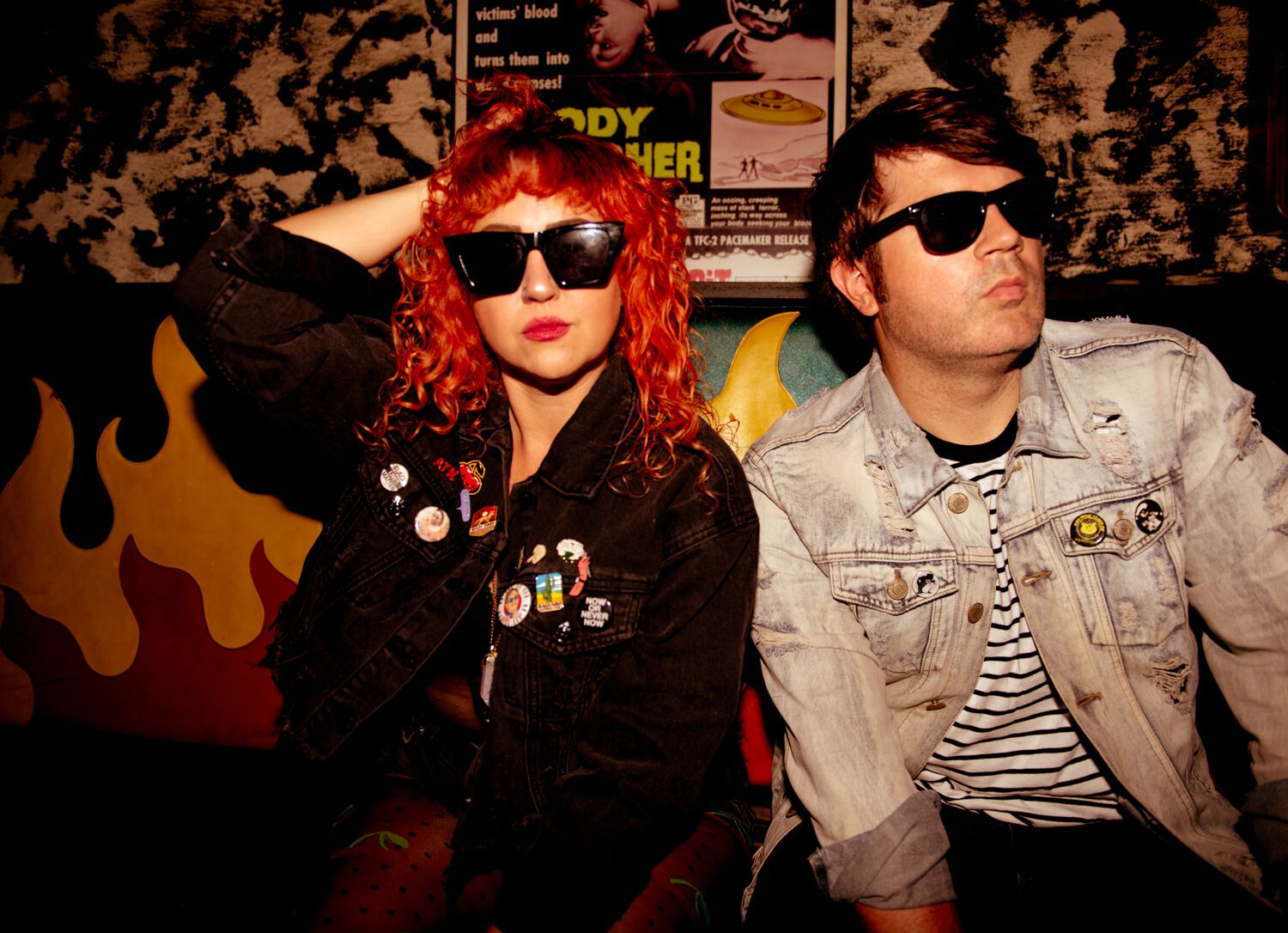 Glass Mansions band members sitting on a couch